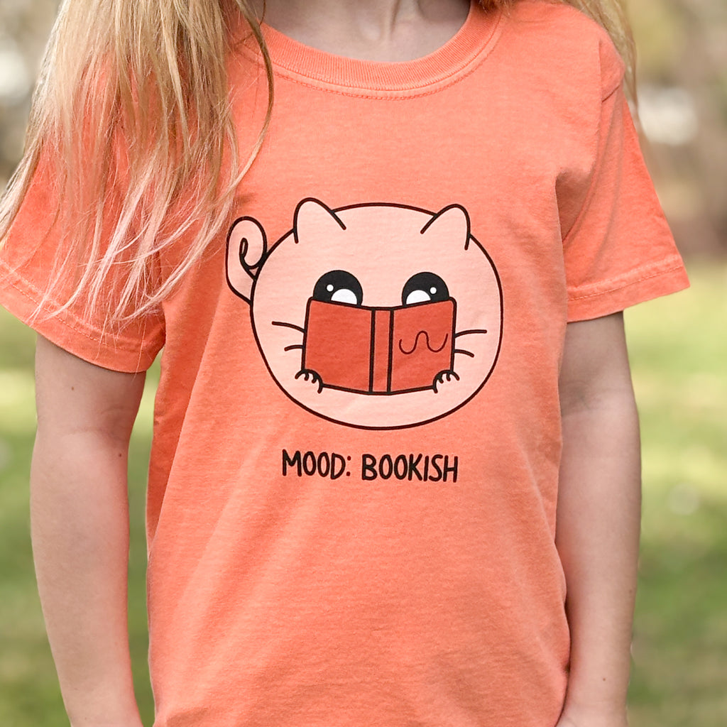 shirt with a cat illustration of a cat reading a book and mood bookish words