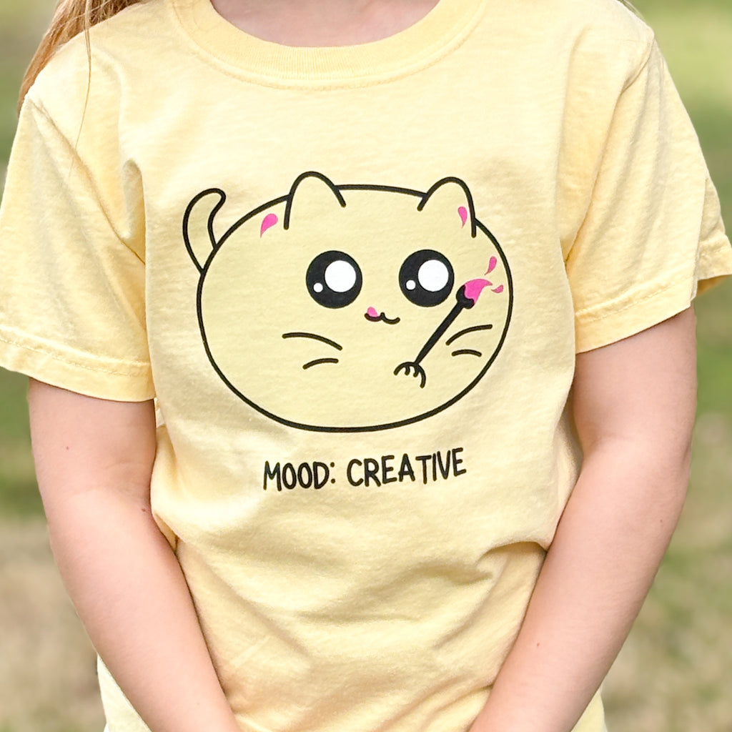 shirt with a cat illustration of a cat with a paint brush and mood creative words